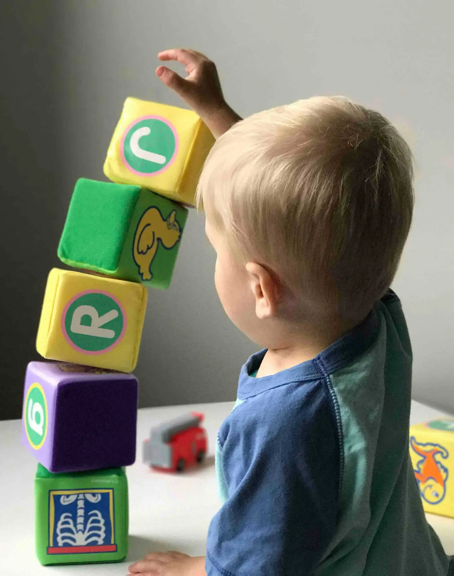 Children's Ministry - a child playing with blocks